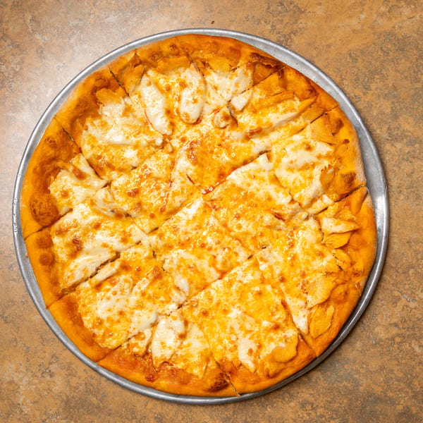 A freshly baked cheese pizza, cut into squares, on a metal pan.